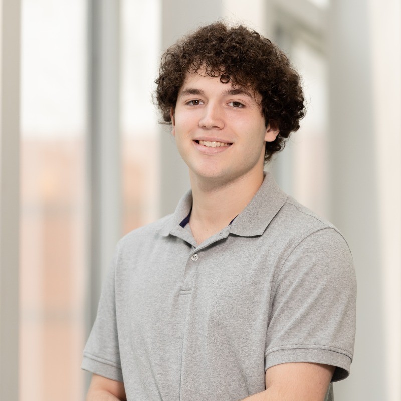 young man in short sleeve grey shirt