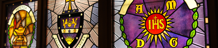 Stained Glass of University and Jesuit Seals and Symbols
